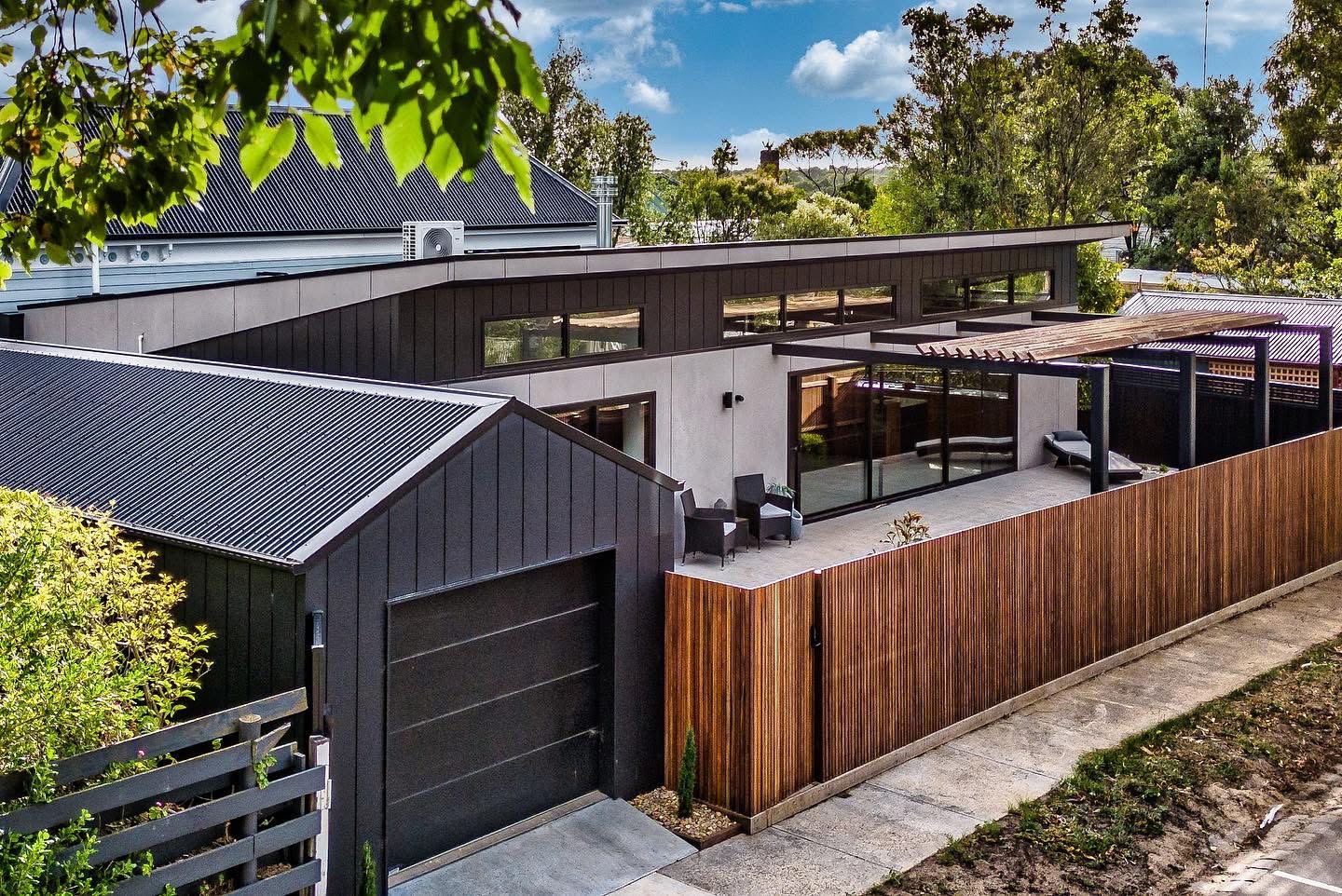 Beautifully painted modern home at golden hour